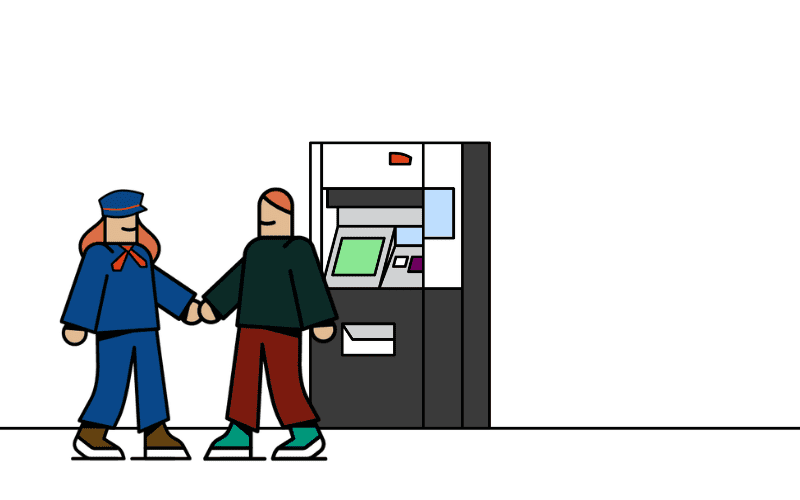 Un agent et un voyageur sont devant un automate de vente